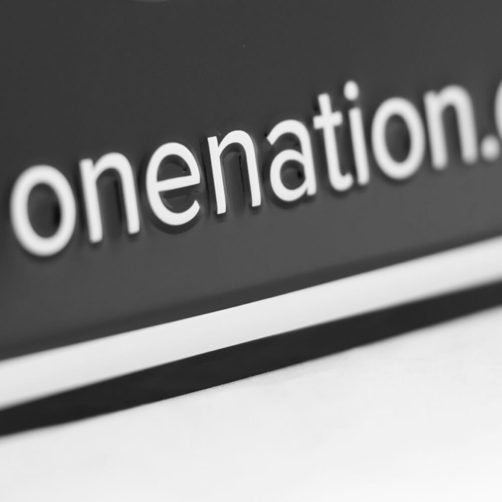Close-up of the onenation.org.au lettering on the novelty licence plate