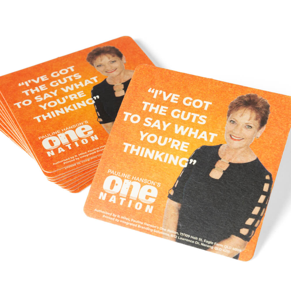 Stack of orange drink coasters with Pauline Hanson and “I’ve got the guts to say what you’re thinking”