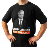 Man wearing the black “Stop Labor – Fire The Liar” T-shirt with a photo of Anthony Albanese