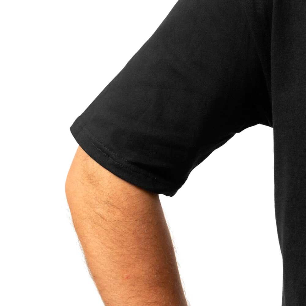 Close-up of the black Fire The Liar T-shirt sleeve