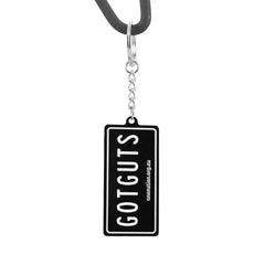 “GOT GUTS” licence plate keyring hanging from its chain