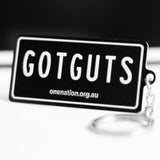 Black “GOT GUTS” metal keyring shaped like a mini licence plate