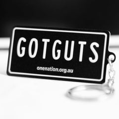 Black “GOT GUTS” metal keyring shaped like a mini licence plate