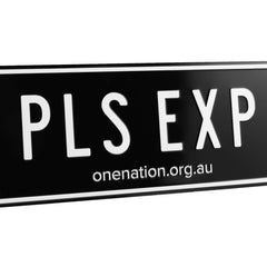 Close-up of the black “PLS EXP” novelty licence plate